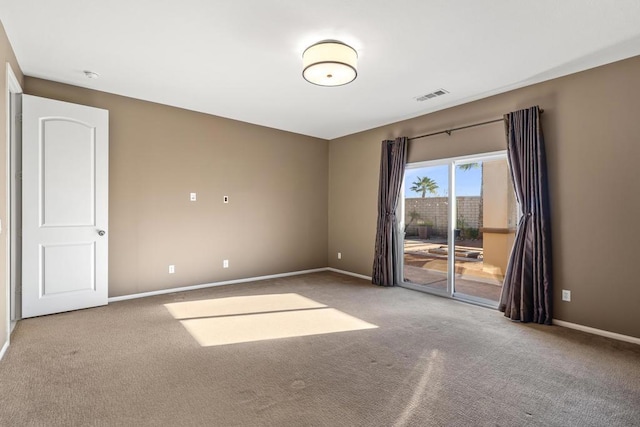 unfurnished room with carpet floors