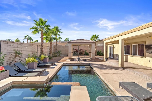 view of swimming pool with a patio area and a gazebo