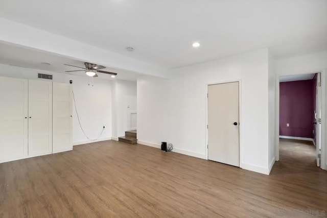 unfurnished room with ceiling fan and hardwood / wood-style floors