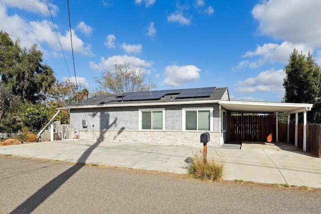 view of front of property with a carport