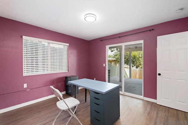 office space with dark wood-type flooring