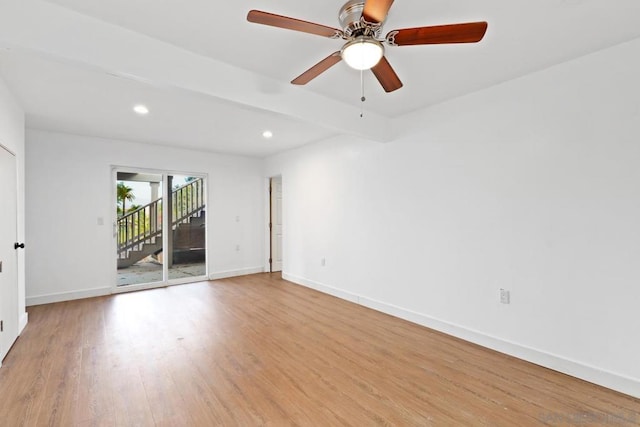 unfurnished room with ceiling fan and light wood-type flooring