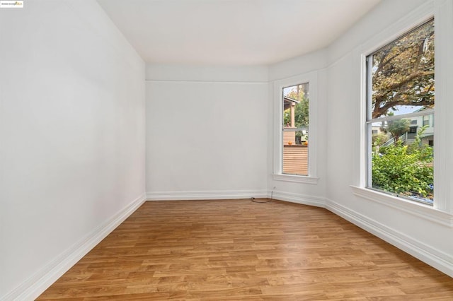 unfurnished room featuring light hardwood / wood-style floors