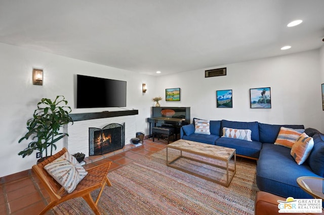 living room featuring tile patterned floors and a fireplace