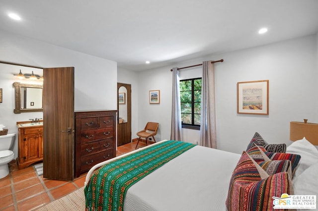 tiled bedroom featuring sink