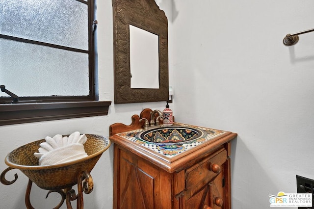 bathroom with a wealth of natural light and vanity