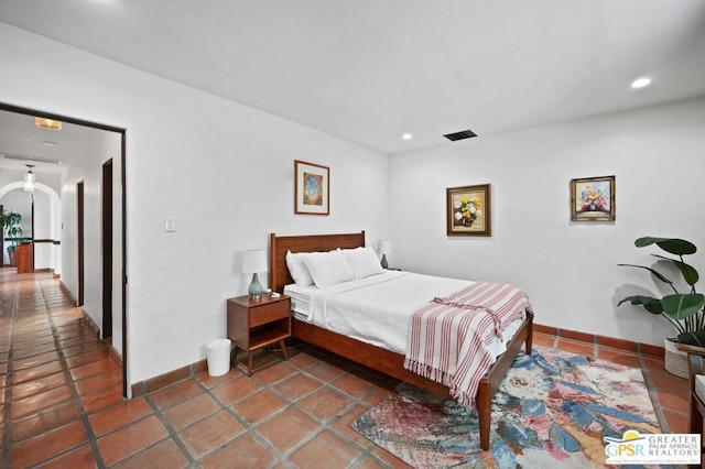 bedroom featuring tile patterned flooring