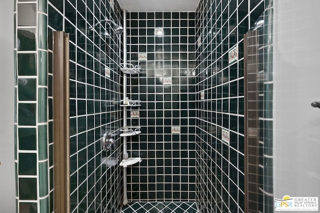 bathroom with a tile shower