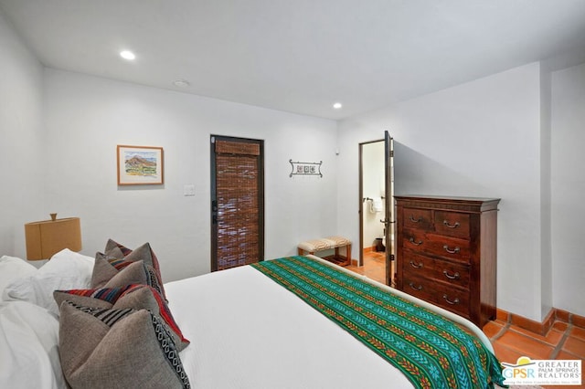 bedroom with light tile patterned floors