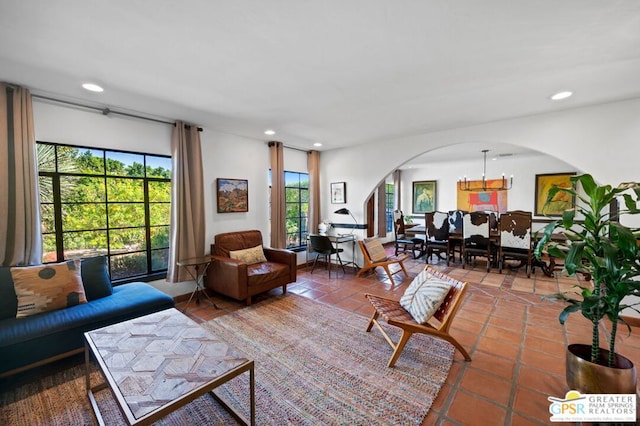 living room with a wealth of natural light and tile patterned floors