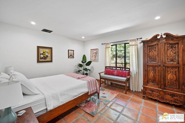 bedroom with light tile patterned flooring