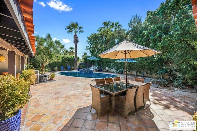 view of pool featuring a patio area