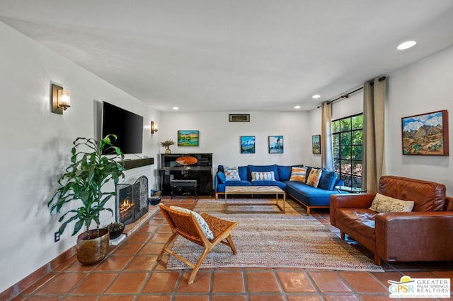 living room with tile patterned flooring