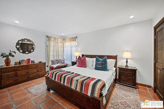 tiled bedroom with a closet