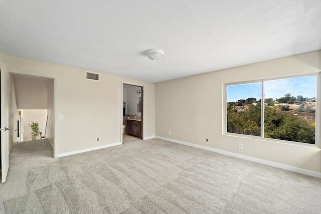 interior space featuring light colored carpet