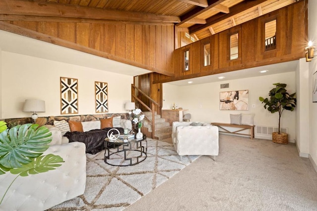 living room with light carpet, wooden ceiling, beam ceiling, and high vaulted ceiling