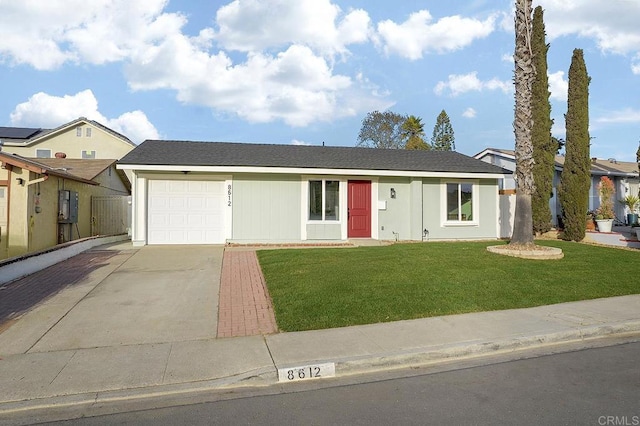 ranch-style house with a garage and a front yard