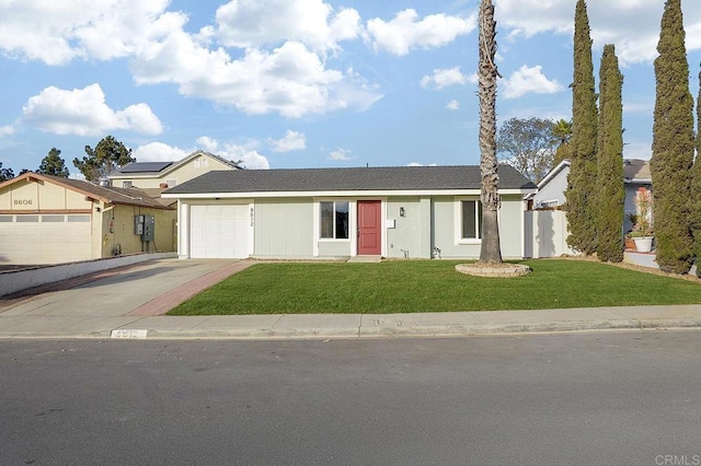 single story home with a garage and a front lawn