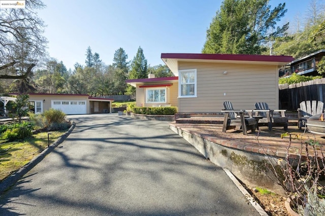 view of front of house featuring a garage and an outdoor structure