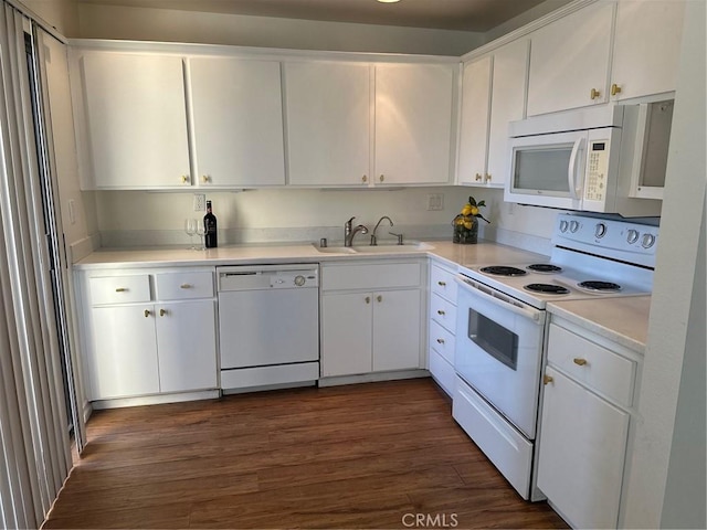 kitchen featuring sink, white appliances, white cabinetry, and dark hardwood / wood-style flooring