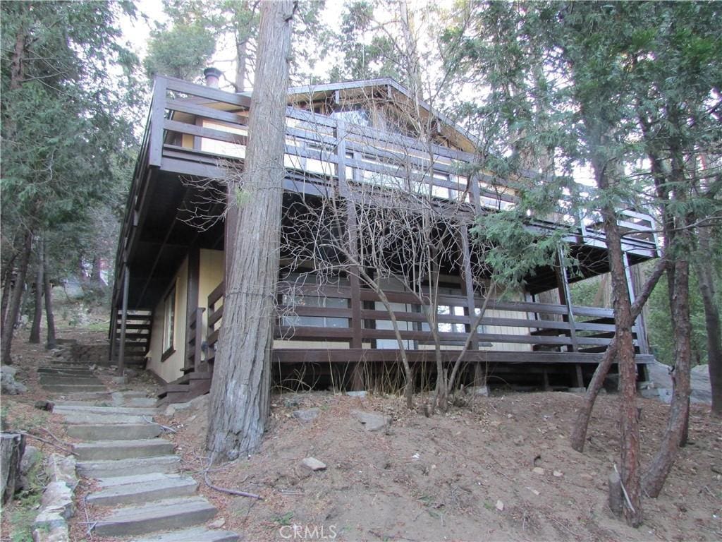 exterior space featuring a wooden deck