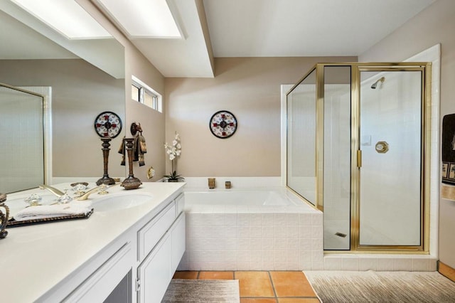 bathroom featuring separate shower and tub, tile patterned flooring, and vanity