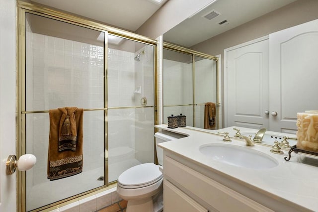 bathroom with toilet, a shower with shower door, and vanity