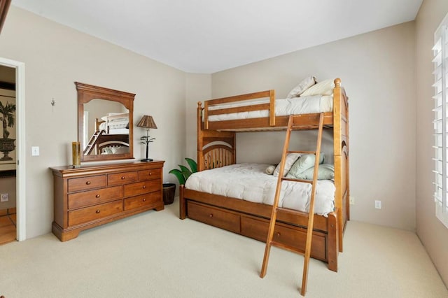 bedroom with light colored carpet