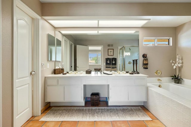 bathroom with tile patterned floors, vanity, and independent shower and bath