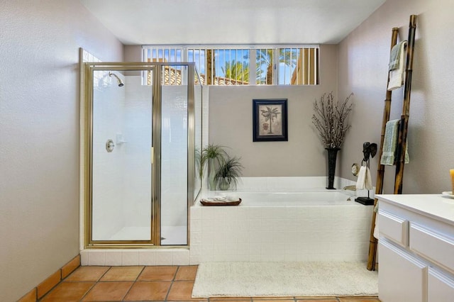 bathroom with vanity, shower with separate bathtub, and tile patterned flooring