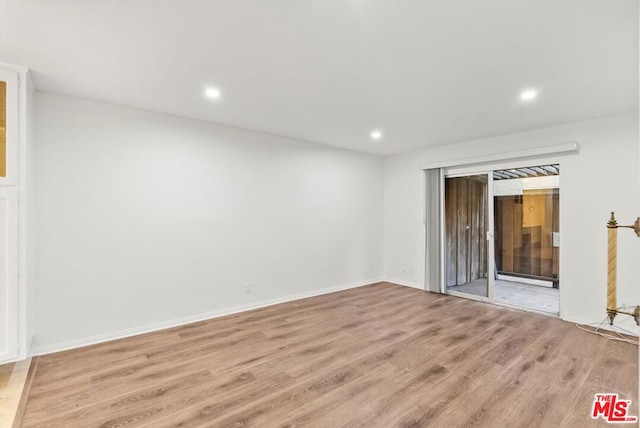 spare room featuring light hardwood / wood-style floors