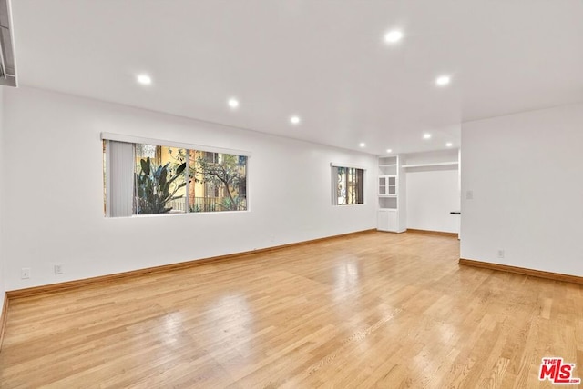 unfurnished living room with light hardwood / wood-style floors