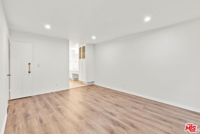 spare room featuring light hardwood / wood-style floors