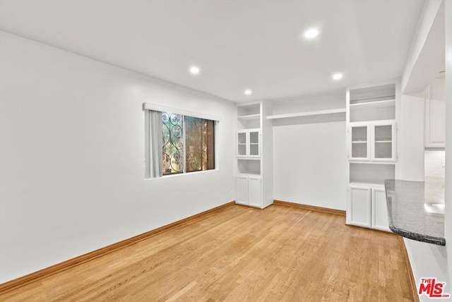 spare room with light hardwood / wood-style floors