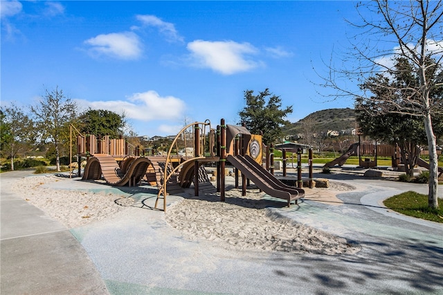 view of playground with a mountain view