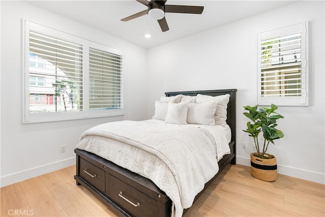 bedroom featuring light wood-type flooring and ceiling fan