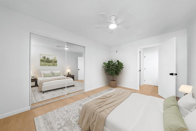 bedroom featuring a closet, ceiling fan, and hardwood / wood-style floors