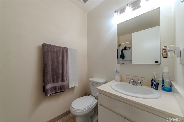 bathroom featuring toilet and vanity