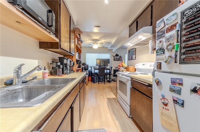 kitchen featuring light hardwood / wood-style flooring, ceiling fan, sink, premium range hood, and white appliances