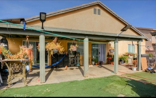 rear view of property with a patio