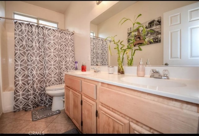 full bathroom featuring shower / bath combination with curtain, vanity, tile patterned floors, and toilet