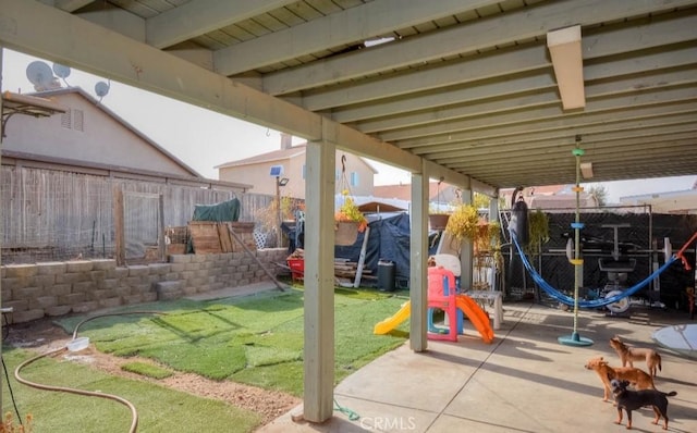 exterior space featuring a patio and a lawn