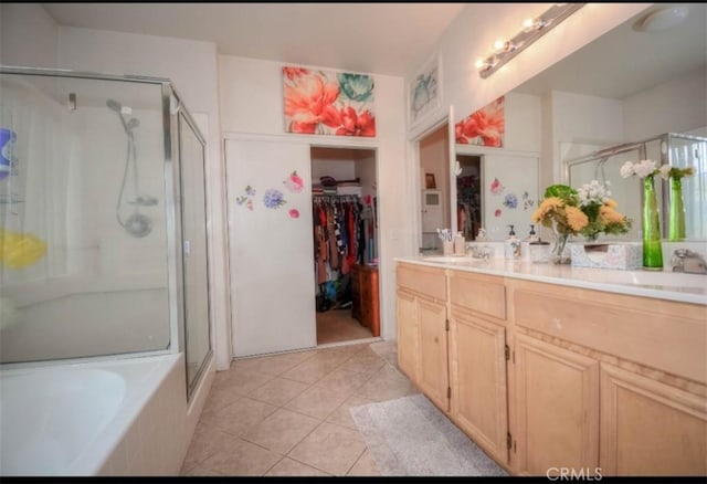 bathroom featuring vanity, tile patterned flooring, and plus walk in shower