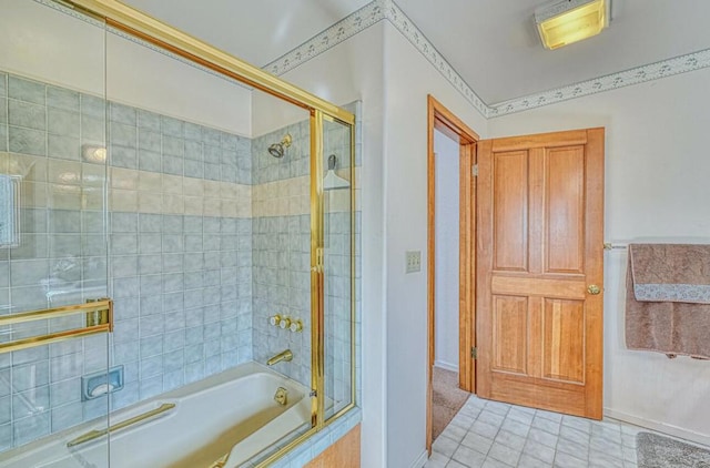 bathroom featuring tile patterned floors and shower / bath combination with glass door