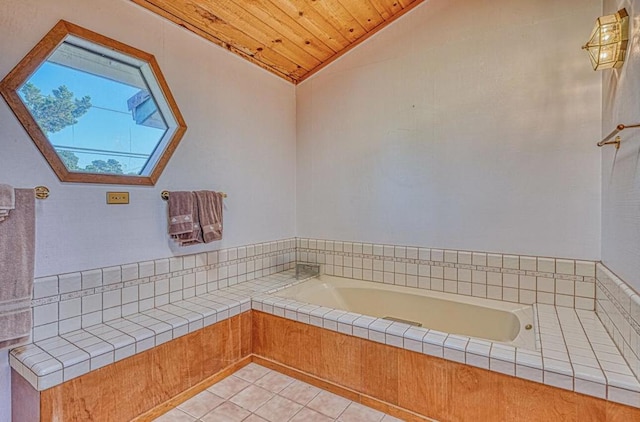 bathroom with a tub, wooden ceiling, tile patterned flooring, and vaulted ceiling