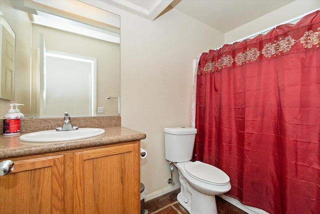 bathroom featuring toilet and vanity