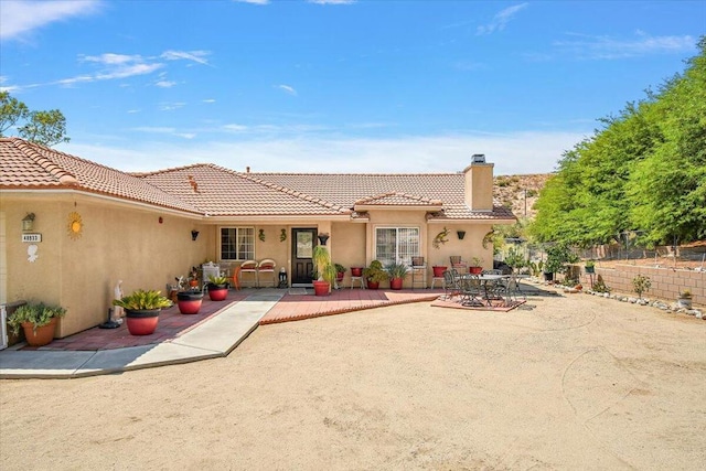 back of property with a patio area