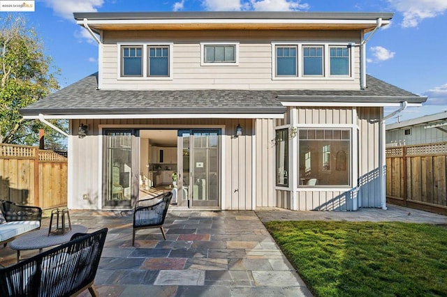 rear view of property featuring a patio