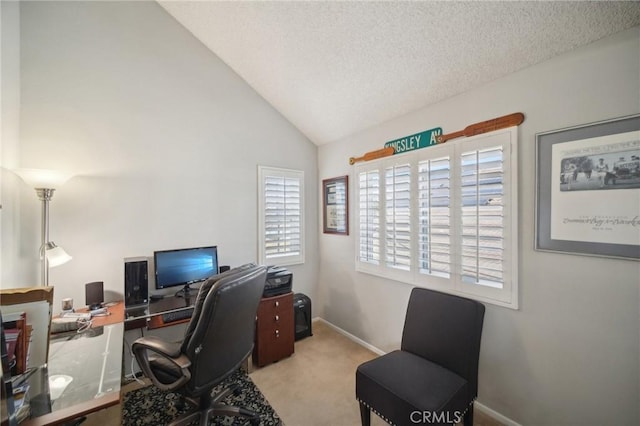 office space featuring light carpet, a textured ceiling, and lofted ceiling