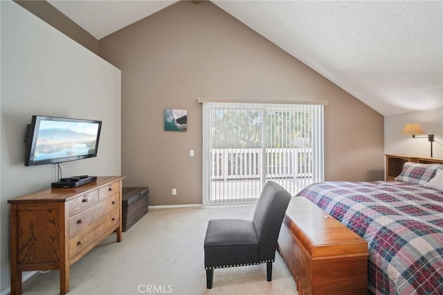 carpeted bedroom featuring access to exterior and lofted ceiling